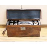 Automobilia related - an early leather cased car picnic hamper, with enamelled plates, basket work