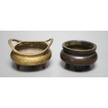 Two Chinese bronze tripod censers largest 10cm handle to handle