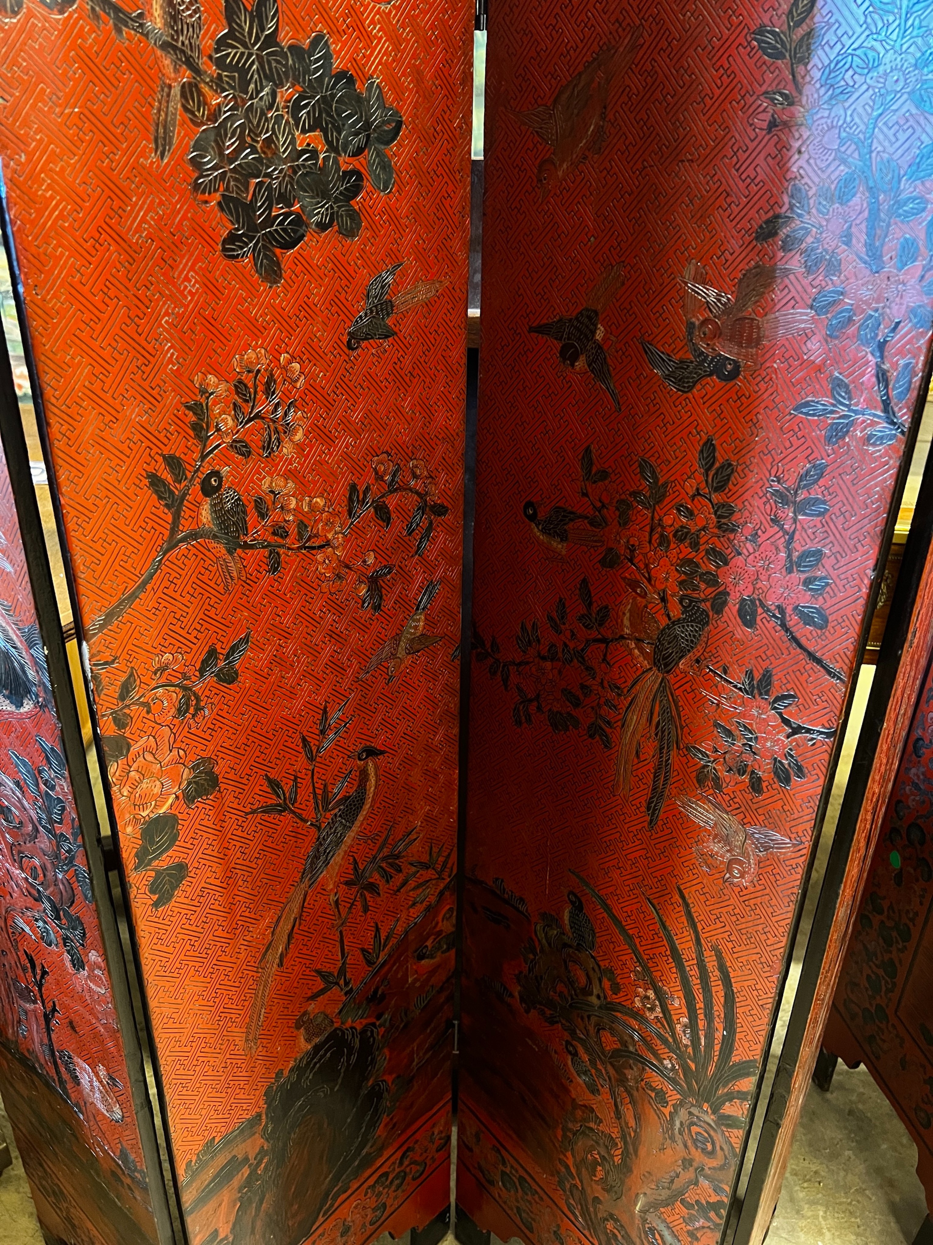 A pair of Chinese four fold lacquer screens decorated with exotic birds amongst branches, each panel - Image 3 of 4