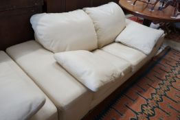 A contemporary Italian design cream leather three seater and two seater settee, larger length 210cm,