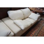 A contemporary Italian design cream leather three seater and two seater settee, larger length 210cm,