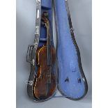 A cased German violin, labelled Stradivarius and dated 1886, back measures 36cm excl button