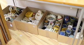 A large quantity of mostly Wade ceramics including some coronation wares, Lurpak butter dishes etc.