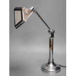 A chrome pirouette adjustable desk lamp