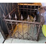 A wrought iron monument surround, width 84cm, depth 92cm, height 85cm