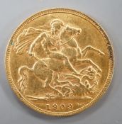 An Edward VII 1909 gold sovereign.