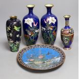 A group of Japanese cloisonné enamel wares to include a pair of vases, two other vases and a dish,