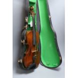 A cased late 19th century English violin, inscribed W. Heaton maker 1887 (?), back measures 35.5cm