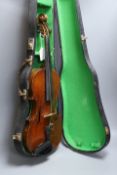 A cased late 19th century English violin, inscribed W. Heaton maker 1887 (?), back measures 35.5cm