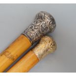 Two 19th century malacca walking canes: one with an Indian inspired 9ct gold handle, the other