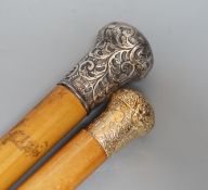Two 19th century malacca walking canes: one with an Indian inspired 9ct gold handle, the other