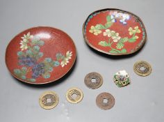 A group of Chinese coins, cloisonné enamel wares and an enamelled badge