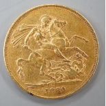 A Victoria 1880 gold sovereign.