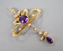 An Edwardian 15ct, amethyst and seed pearl set drop pendant brooch, overall 49mm, gross weight 5.3