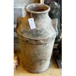 A glazed earthenware faux cast iron urn modelled as a milk churn, height 56cm