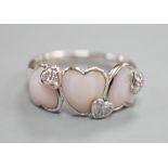 A modern 750 white metal three stone heart shaped mother of pearl? and diamond chip cluster set half
