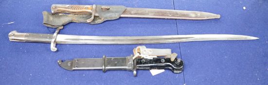Two bayonets - one by P.D. Lüneschloss, Solingen - together with a dagger