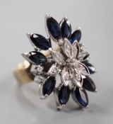 A modern 18k, sapphire and illusion set diamond chip set cluster dress ring, size K, gross weight