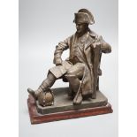An early 20th century bronzed metal table lamp moulded as Napoleon seated, 26cm