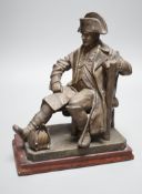 An early 20th century bronzed metal table lamp moulded as Napoleon seated, 26cm