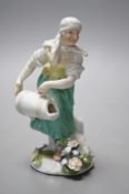 An 18th century Meissen figure of a girl pouring water from a jug on flowers at her feet, c.1755,