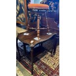 A late 19th century French walnut revolving adjustable piano stool and a Victorian mahogany centre