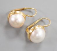A modern pair of Italian 750 yellow metal and mabe pearl set earrings, diameter 11mm, gross weight