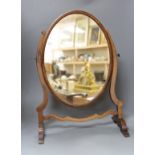 A swing mahogany frame toilet mirror with satinwood banding, 53cm tall