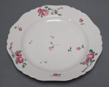 Seventeen late 18th century Continental porcelain rose painted plates 24cm