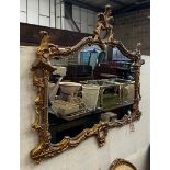 A Chinese Chippendale style giltwood framed and composition rectangular wall mirror, width 116cm,