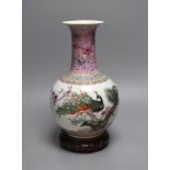 A Chinese famille rose vase, 27cm, on carved wood stand