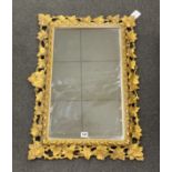 A giltwood carved giltwood wall mirror with ivy leaf border, width 52cm, height 76cm