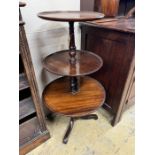 A George III and later mahogany three tier dumb waiter, height 102cm