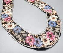 A 1920’s-30’s French beaded collar, the beads embroidered as flowers and leaves with leather applice