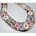 A 1920’s-30’s French beaded collar, the beads embroidered as flowers and leaves with leather applice