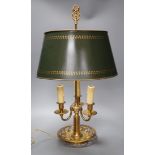 A gilt brass bouillote lamp with tole ware shade,57 cms high,