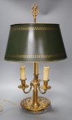 A gilt brass bouillote lamp with tole ware shade,57 cms high,