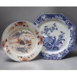 A Chinese blue and white octagonal plate with botanical decoration, together with another Chinese