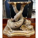 A 19th century carved parcel gilt pine entwined dolphin support, width 54cm, height 50cm