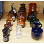 Nine glass chemist jars and covers, two decanters, two rinsers, and a cranberry jug and a mug,