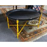 An oval Regency style black japanned tin tray on folding stand, tray width 80cm, depth 61cm,