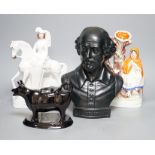 A Wedgwood glazed black basalt bust of Shakespeare, two Victorian Staffordshire figures and a cow