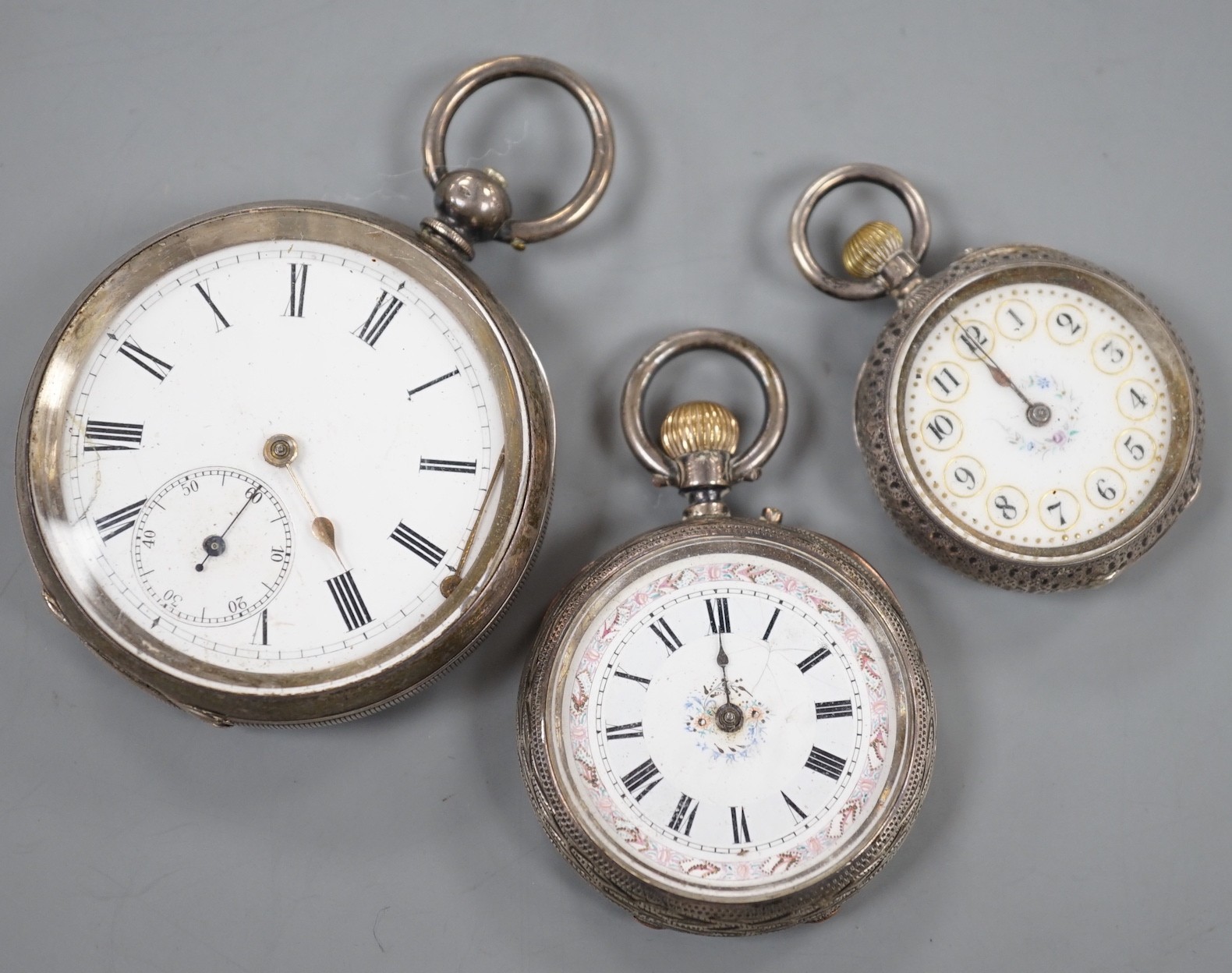 A Swiss 935 white metal open faced pocket watch and two fob watches=, silver a 935 white metal.