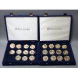 Two sets of Westminster coins in blue cases