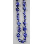 A single strand lapis lazuli round and barrel bead necklace, 72cm.