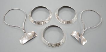 A set of three George silver decanted wine collar labels, Robert Barker, London, 1793 and a pair