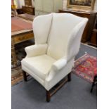 A George III style mahogany framed upholstered wing armchair, width 80cm, depth 64cm, height 122cm
