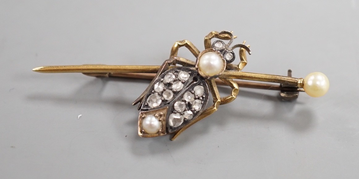 An early 20th century white and yellow metal, rose cut diamond and split pearl cluster set bug bar