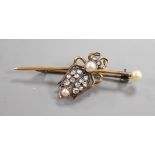 An early 20th century white and yellow metal, rose cut diamond and split pearl cluster set bug bar