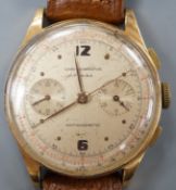 A 1940/1950's? Swiss 18k chronograph wrist watch, with two subsidiary dials, on a brown leather
